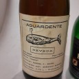 Duas Garrafas de Aguardente e Bagaceira