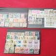 4 carteiras com selos novos da Guiné, Macau, Timor, Angola