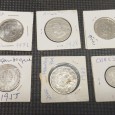 Seis moedas sendo 50 centavos de Cabo Verde, 20 escudos de Moçambique de 1955, 1960 e 1971, 50 centavos de 1928 de Angola e 20 escudos de 1971