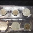 Quatro moedas de 100$ e quatro moedas de 500$ escudos Macau
