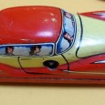 Três carros de coleção de lata e outro
